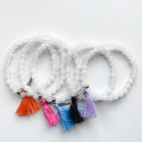Bracelet 6mm quartz neige avec aile et pompon